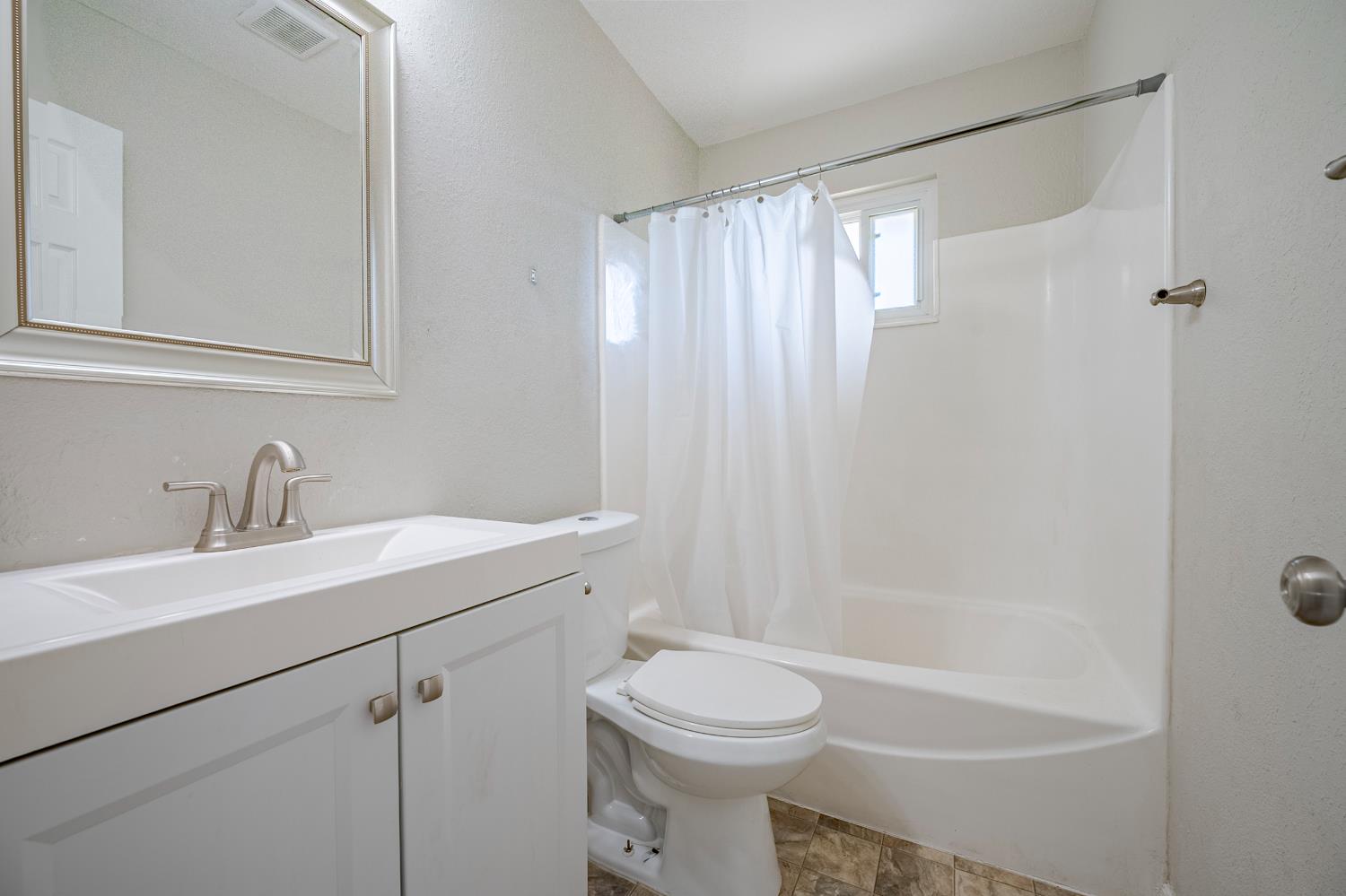 3085 North Buhach Road Atwater, CA 95301 - Photo 40 of 40 a bathroom with a sink a toilet and shower