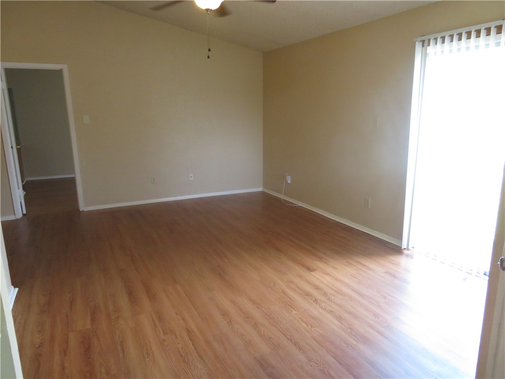 3709 Leafield Drive, Unit B Austin, TX 78749 - Photo 2 of 10 a view of an empty room with wooden floor