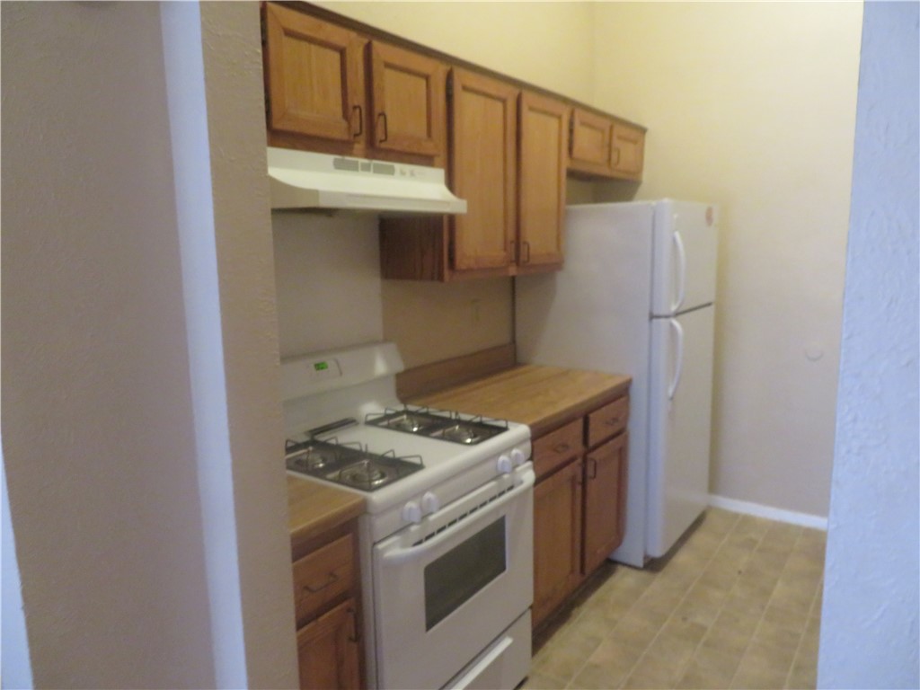 3709 Leafield Drive, Unit B Austin, TX 78749 - Photo 4 of 10 a kitchen with a stove and a refrigerator