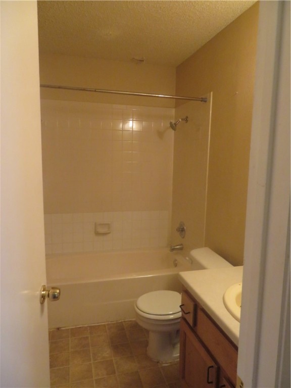3709 Leafield Drive, Unit B Austin, TX 78749 - Photo 8 of 10 a bathroom with a granite countertop bathtub shower sink vanity and toilet