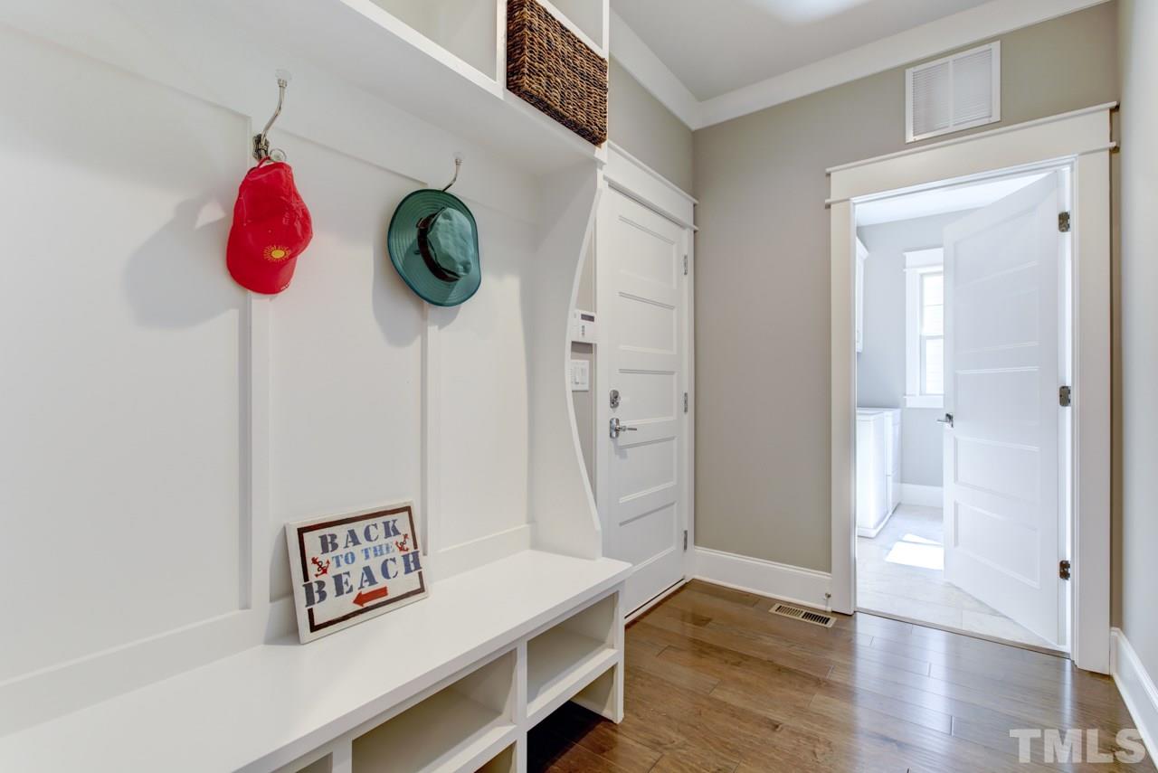 1003 Collins Drive Raleigh, NC 27609 - Photo 11 of 25 Just off the kitchen is a mud room and spacious laundry room.