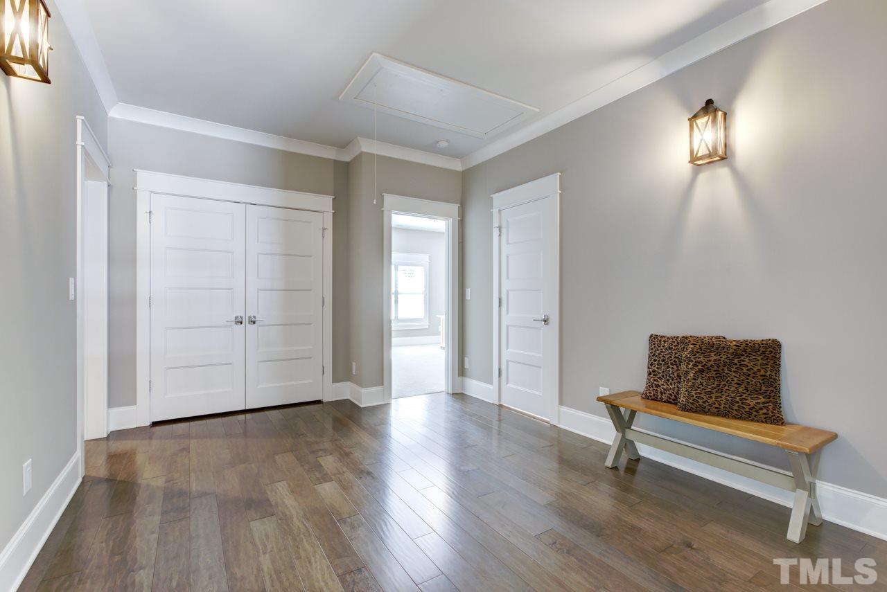 1003 Collins Drive Raleigh, NC 27609 - Photo 15 of 25 Journey upstairs and you’ll find a spacious hallway/loft area with a large closet for storage.