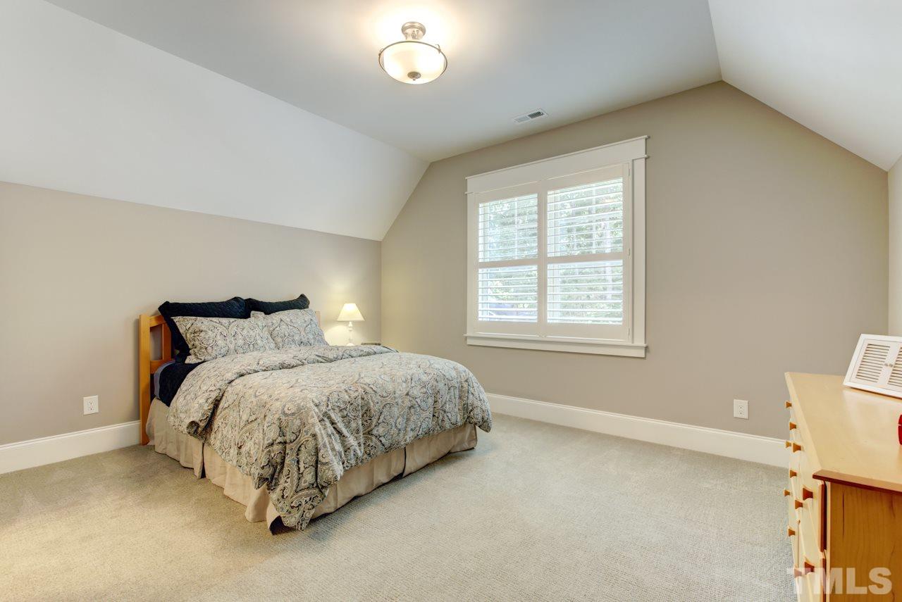 1003 Collins Drive Raleigh, NC 27609 - Photo 16 of 25 There are three additional bedrooms all with walk-in closets, and two with attached full baths.