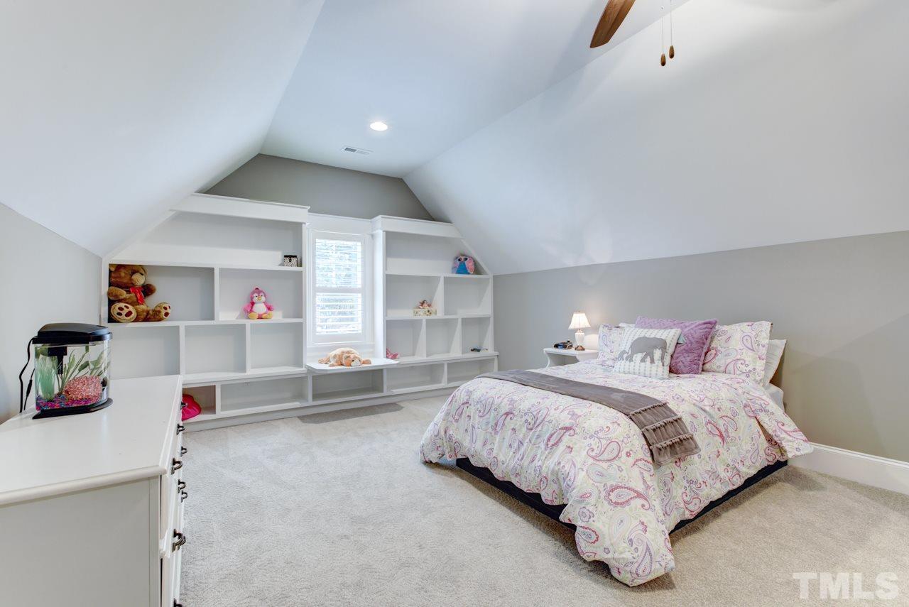 1003 Collins Drive Raleigh, NC 27609 - Photo 17 of 25 There are three additional bedrooms all with walk-in closets, and two with attached full baths.