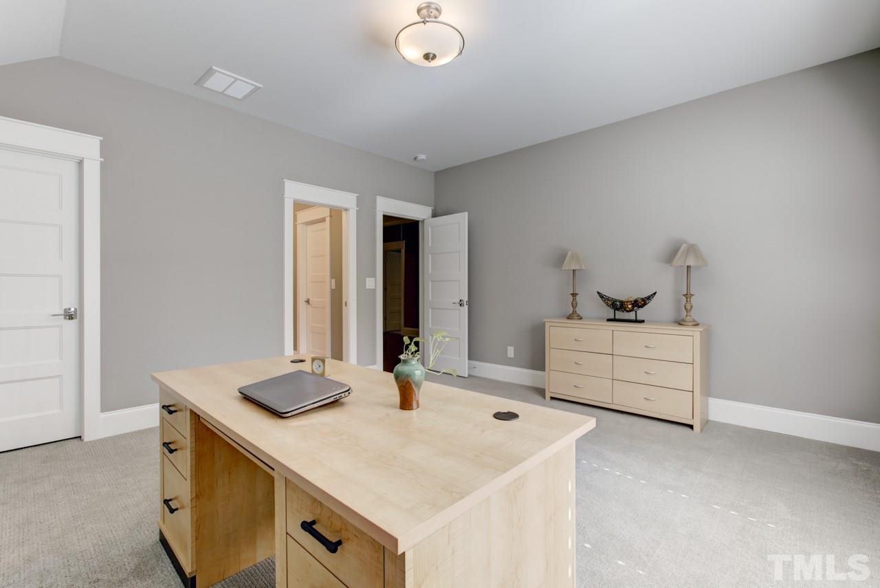 1003 Collins Drive Raleigh, NC 27609 - Photo 18 of 25 There are three additional bedrooms all with walk-in closets, and two with attached full baths.