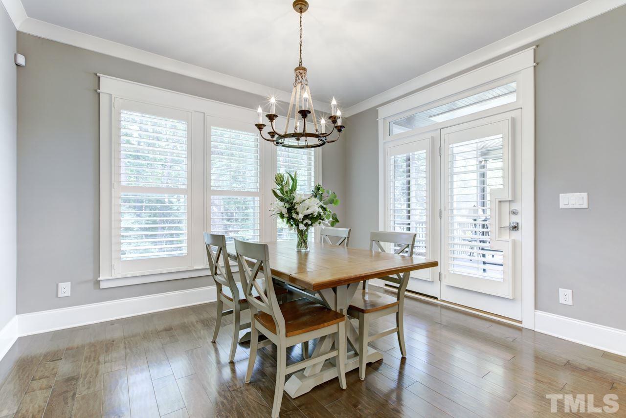 1003 Collins Drive Raleigh, NC 27609 - Photo 8 of 25 Enjoy your morning coffee in the bright breakfast area while gazing upon the peaceful wooded views.