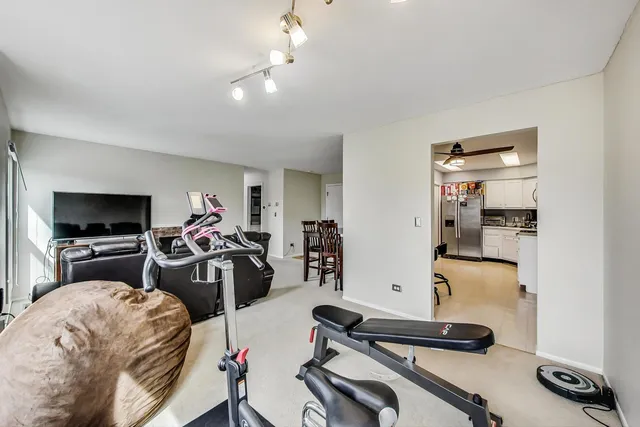 a view of a livingroom with furniture and a flat screen tv