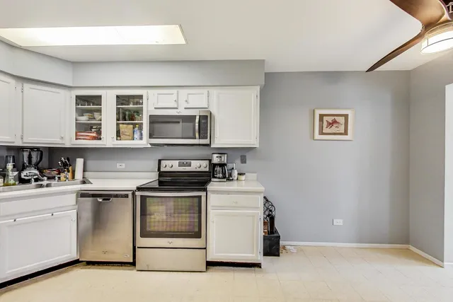 a kitchen with a stove and a microwave