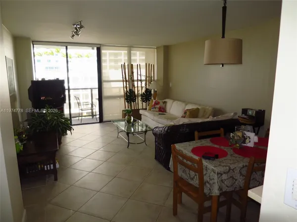 a room with furniture and a flat screen tv