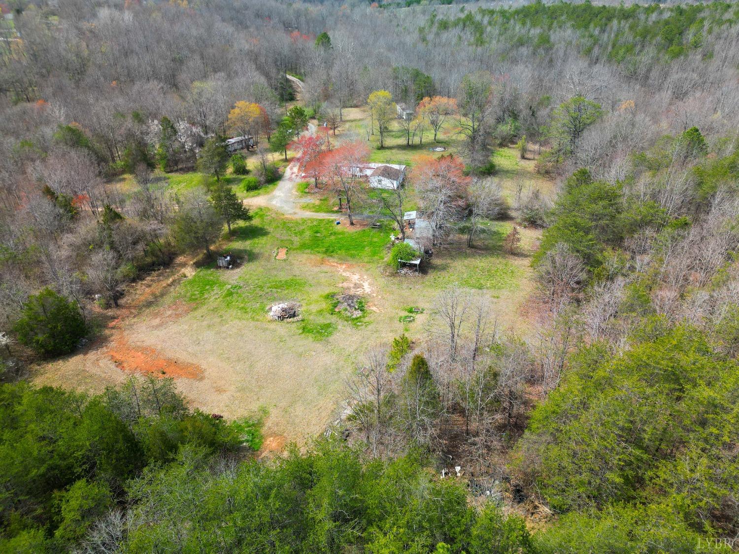 949 Toytown Road Amherst, VA 24521 - Photo 1 of 38 a backyard of a house with a yard and lake view