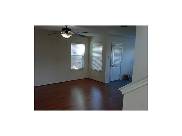 a view of a livingroom with wooden floor