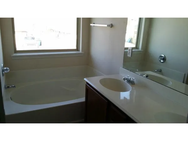 a bathroom with a sink a vanity and a mirror