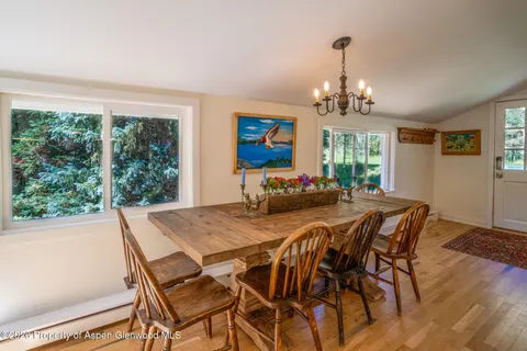a view of a dining room with furniture window and outside view