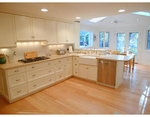 11 Inverness Road Wellesley, MA 02481 - Photo 4 of 14 a kitchen with kitchen island granite countertop a sink and cabinets