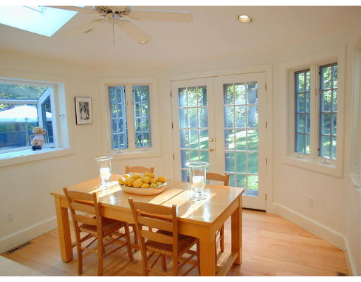 11 Inverness Road Wellesley, MA 02481 - Photo 9 of 14 a dining room with a table and chairs