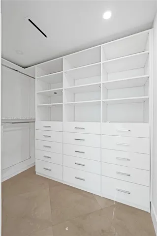 a bathroom with a shower and a sink