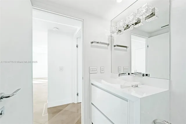 a view of a hallway with washer and dryer