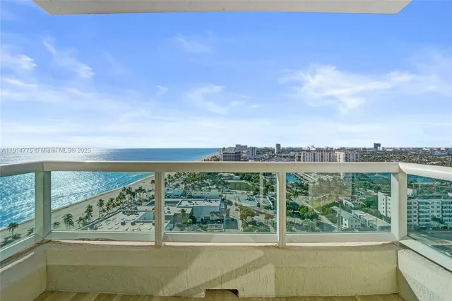 a balcony with view of outdoor space