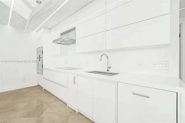 a bathroom with a sink a mirror and a shower