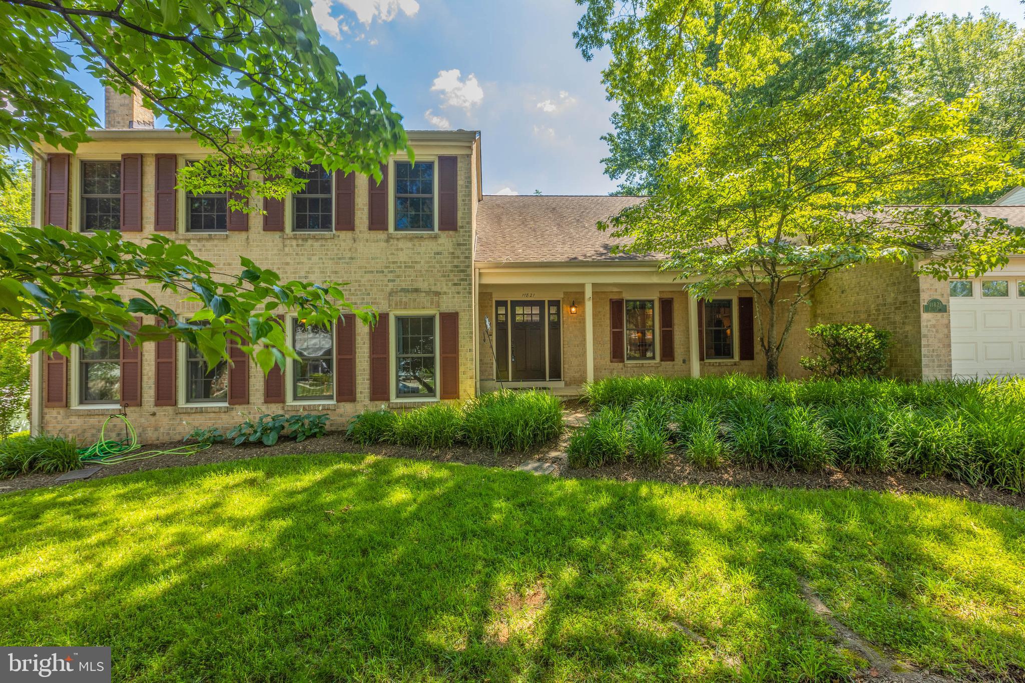 11821 Riders Lane Reston, VA 20191 - Photo 1 of 44 front view of a house with a yard