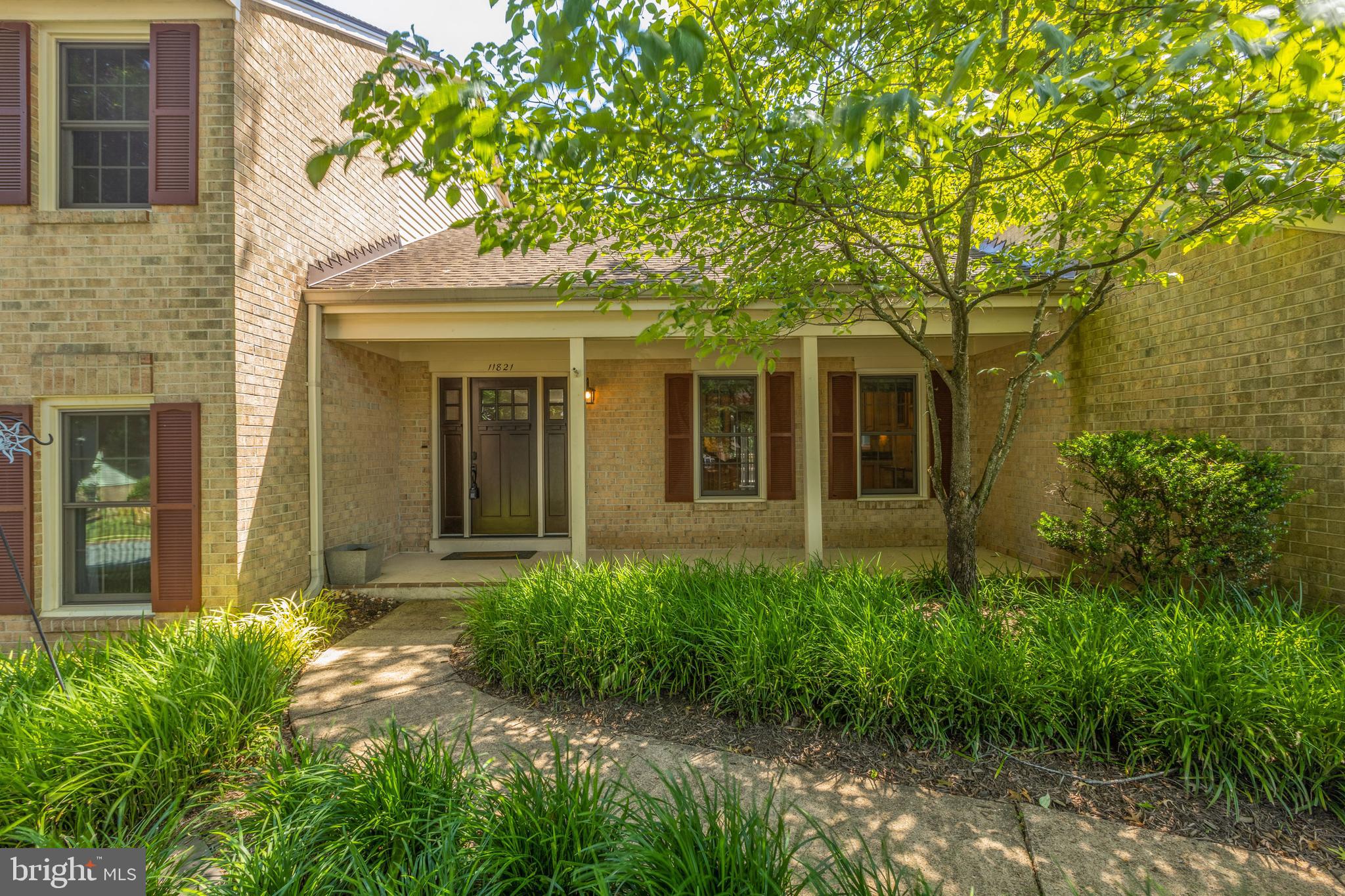 11821 Riders Lane Reston, VA 20191 - Photo 2 of 44 front view of a house with a yard