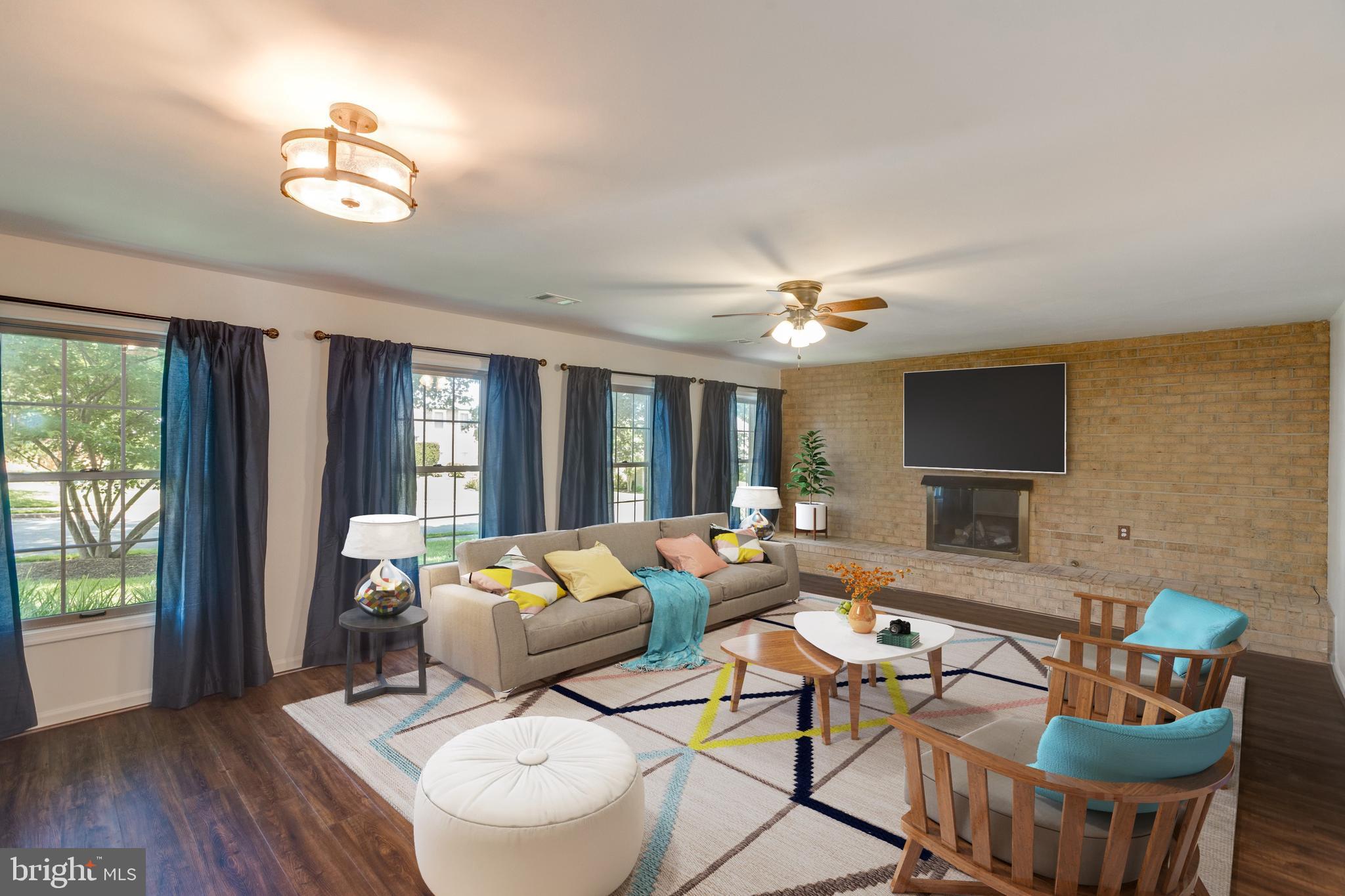 11821 Riders Lane Reston, VA 20191 - Photo 19 of 44 a living room with furniture and a chandelier