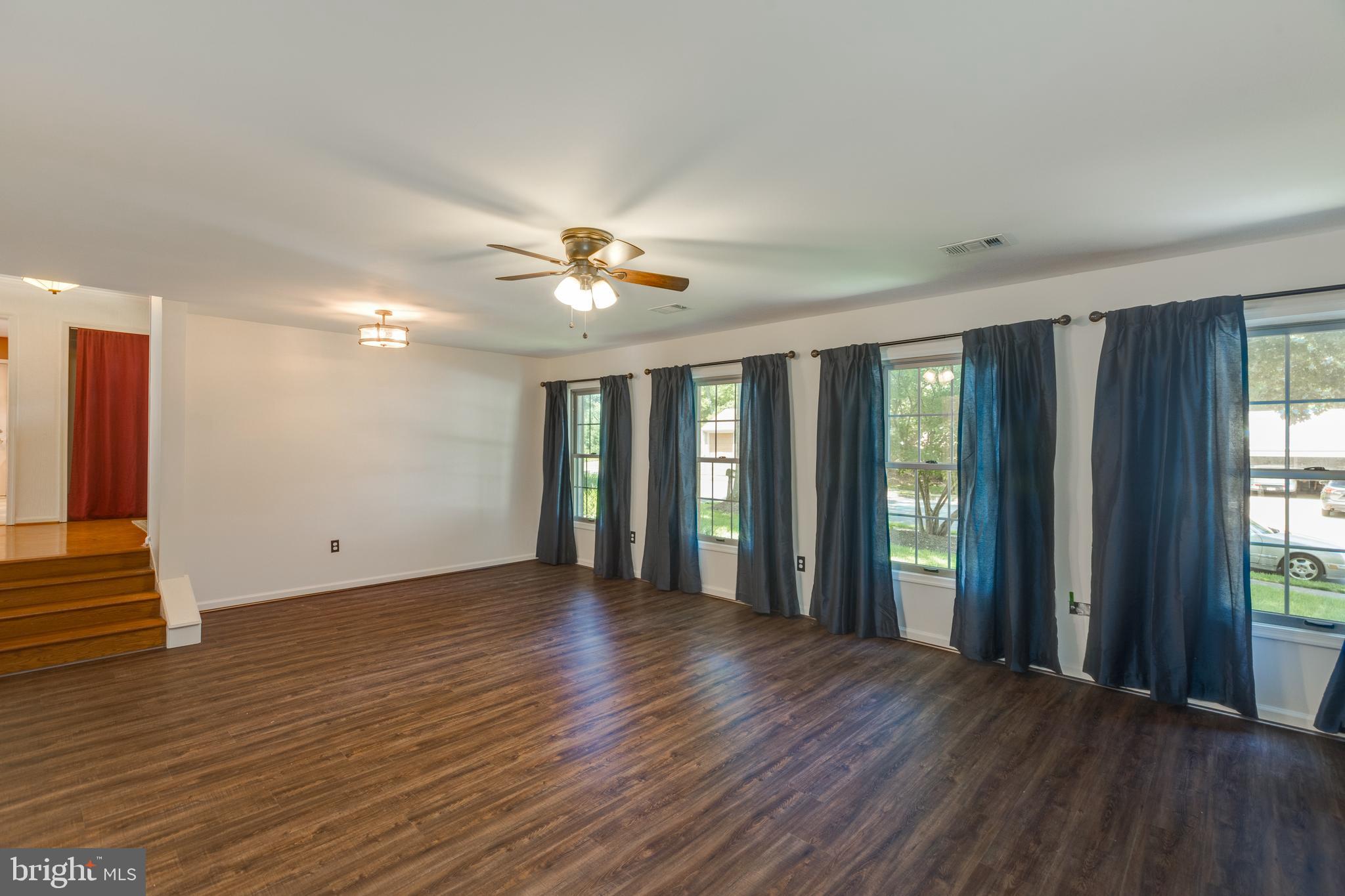 11821 Riders Lane Reston, VA 20191 - Photo 20 of 44 a view of an empty room with wooden floor and a window