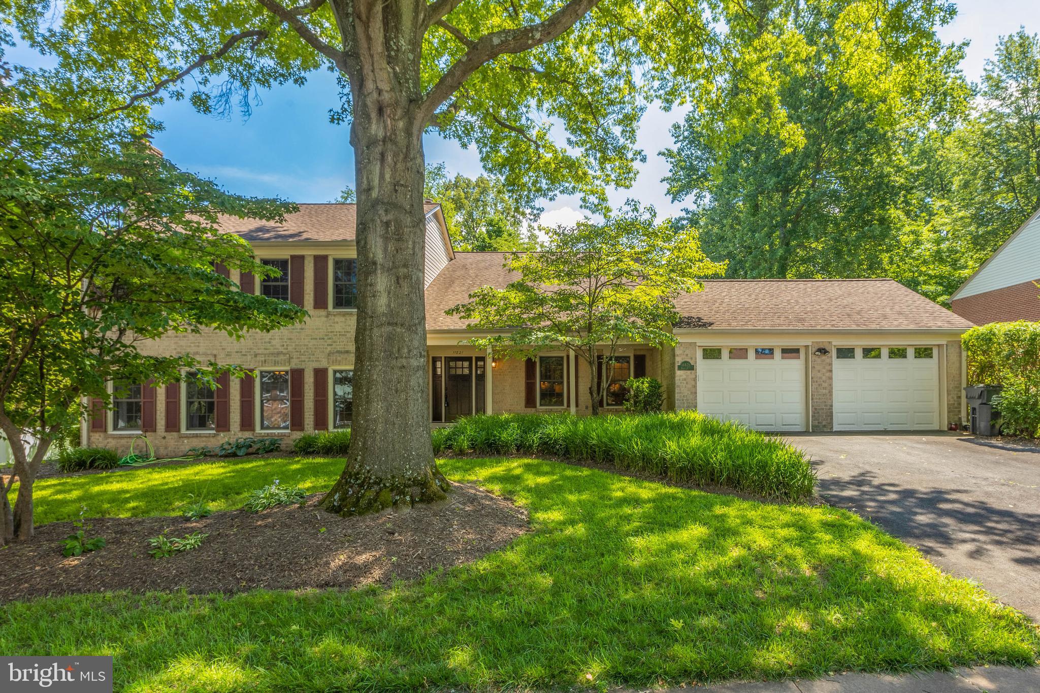 11821 Riders Lane Reston, VA 20191 - Photo 3 of 44 front view of a house with a yard