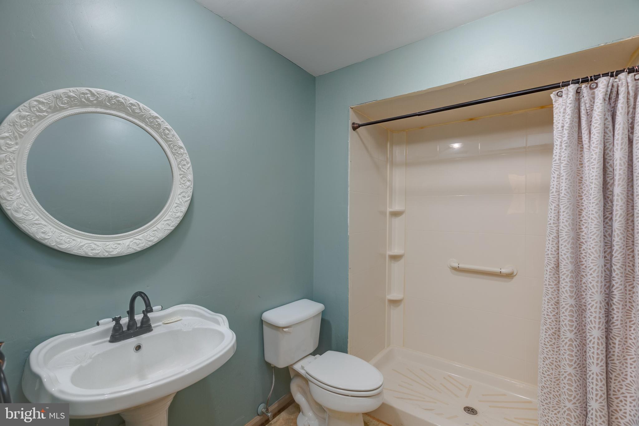 11821 Riders Lane Reston, VA 20191 - Photo 21 of 44 a bathroom with a sink a toilet and shower