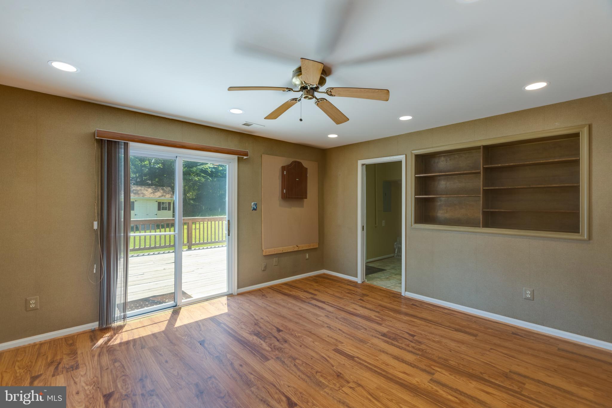 11821 Riders Lane Reston, VA 20191 - Photo 23 of 44 a view of an empty room with wooden floor and a window