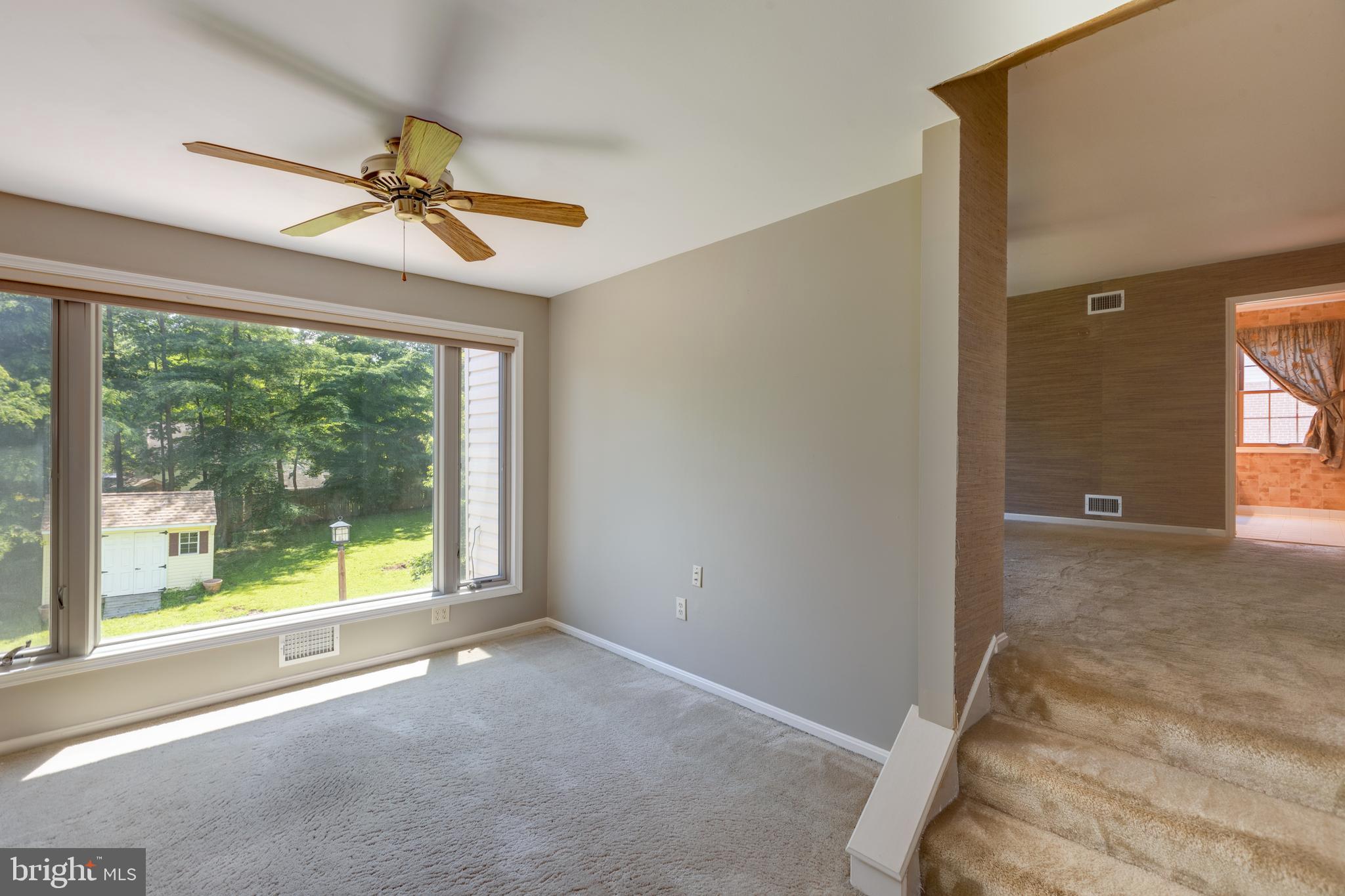 11821 Riders Lane Reston, VA 20191 - Photo 24 of 44 a view of room with a ceiling fan and window