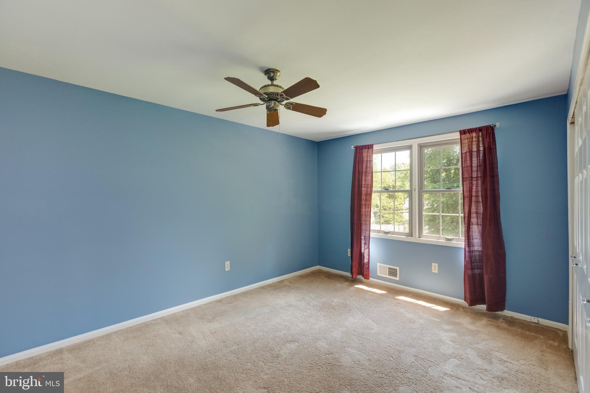 11821 Riders Lane Reston, VA 20191 - Photo 30 of 44 a view of a livingroom with a ceiling fan and window