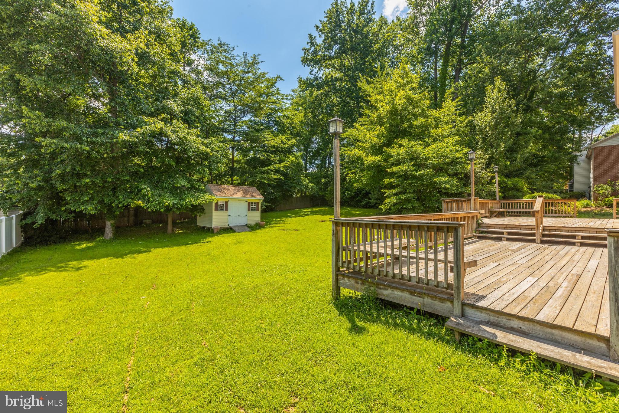 11821 Riders Lane Reston, VA 20191 - Photo 36 of 44 a view of a swimming pool with a patio and a yard