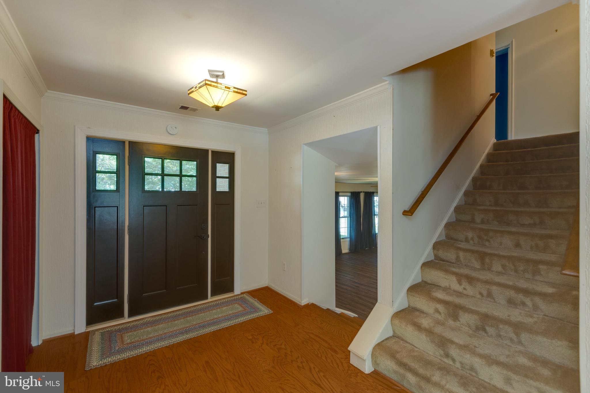 11821 Riders Lane Reston, VA 20191 - Photo 6 of 44 a view of entryway with wooden floor