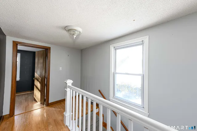 a view of a hallway with a window