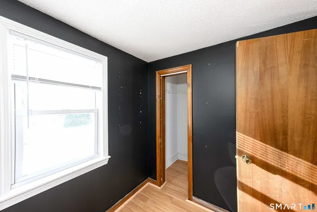 a view of bedroom with a large window