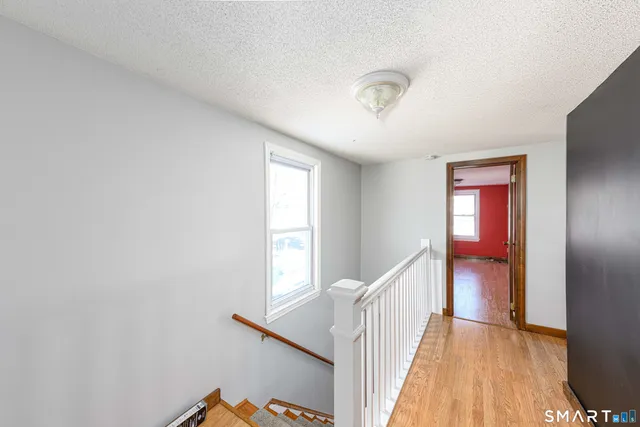 a view of entryway with wooden floor