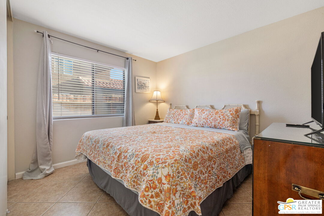 45688 Sutter Creek Road Indio, CA 92201 - Photo 32 of 51 a bed sitting in a bedroom next to a window