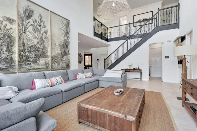 a kitchen with kitchen island granite countertop a sink stove and cabinets