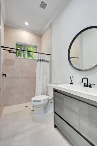 a kitchen with cabinets stainless steel appliances and sink