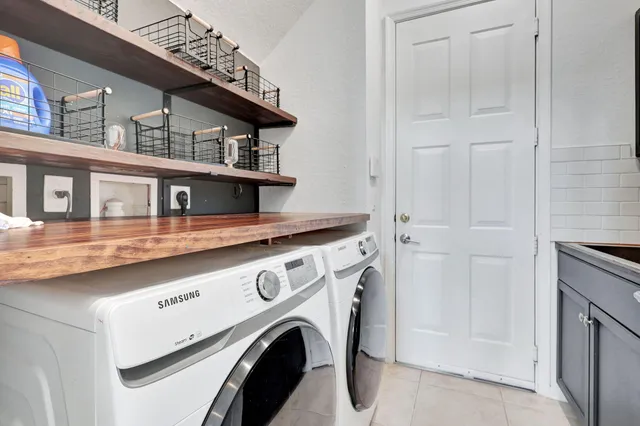 a kitchen with a stove a sink and a microwave