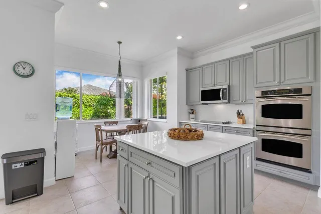 a view of a room with furniture and wooden floor
