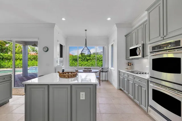 a view of a hallway with a potted plant on a table