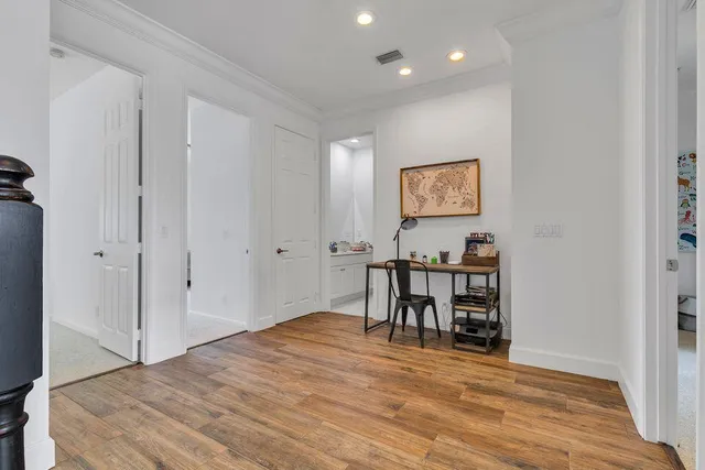 a bedroom with two beds and a chandelier