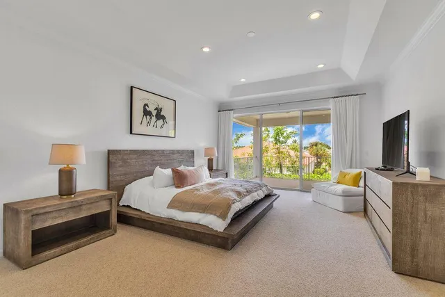a view of a patio with table and chairs potted plants