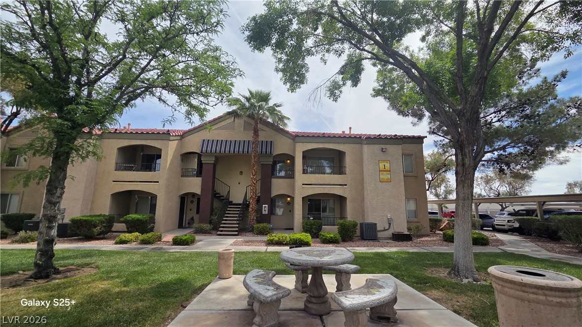 7885 West Flamingo Road, Unit 1008 Las Vegas, NV 89147 - Photo 29 of 29 A well-maintained low-rise residential building provides comfortable living with private balconies and covered parking.