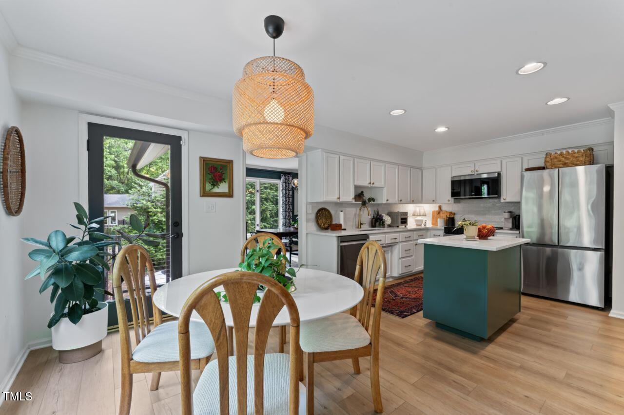 10817 Brass Kettle Road Raleigh, NC 27614 - Photo 15 of 55 Lovely Kitchen with Eat in Area leads to Deck with NEW composite Deck that stays cools and is mainenance free.