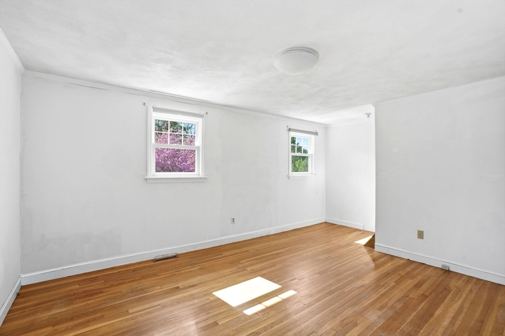 3 Fairway Drive Canton, MA 02021 - Photo 20 of 34 an empty room with wooden floor and windows