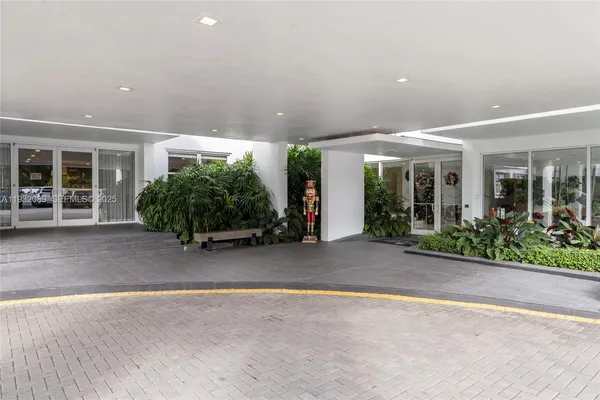 a view of a building with potted plants