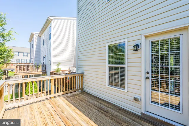 a view of a balcony with wooden floor